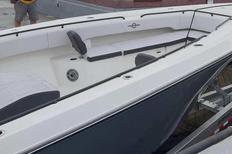 Slide: The Image of 2023 Fountain 38 CC Tournament Edition boat interior with seating and speaker detail. - 31