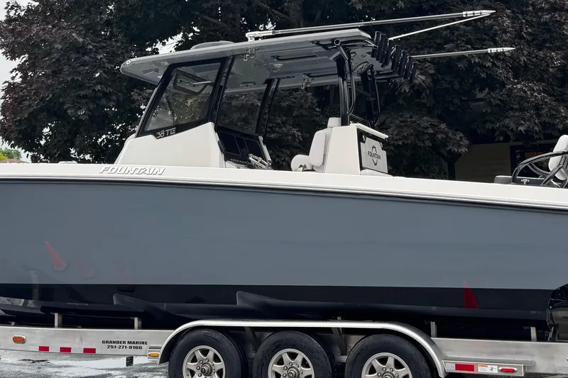 Slide: The Image of 2023 Fountain 38 CC Tournament Edition boat on trailer, side view. - 4