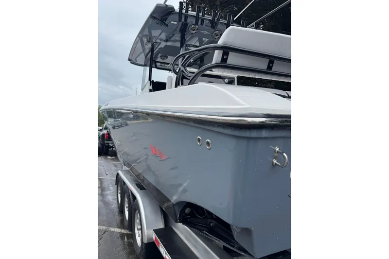 Slide: The Image of 2023 Fountain 38 CC Tournament Edition boat on trailer, sleek design, overcast sky. - 6