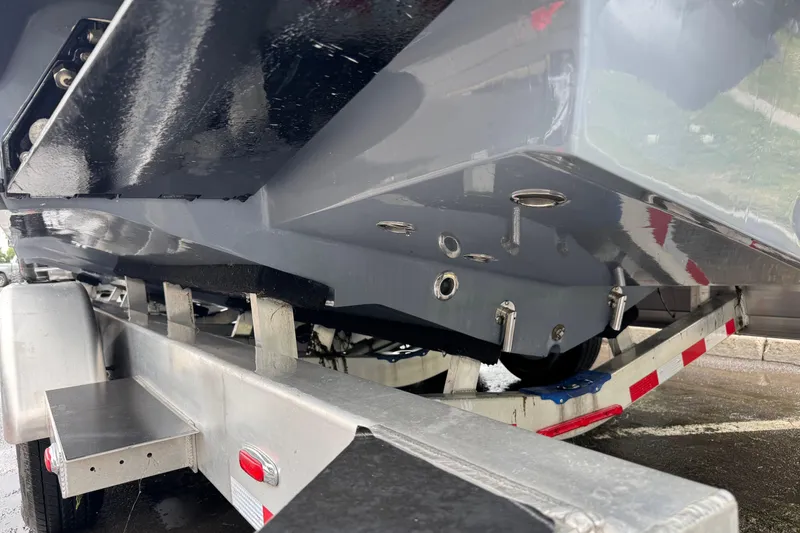 Slide: The Image of 2023 Fountain 38 CC Tournament Edition boat on trailer, showcasing hull details. - 7
