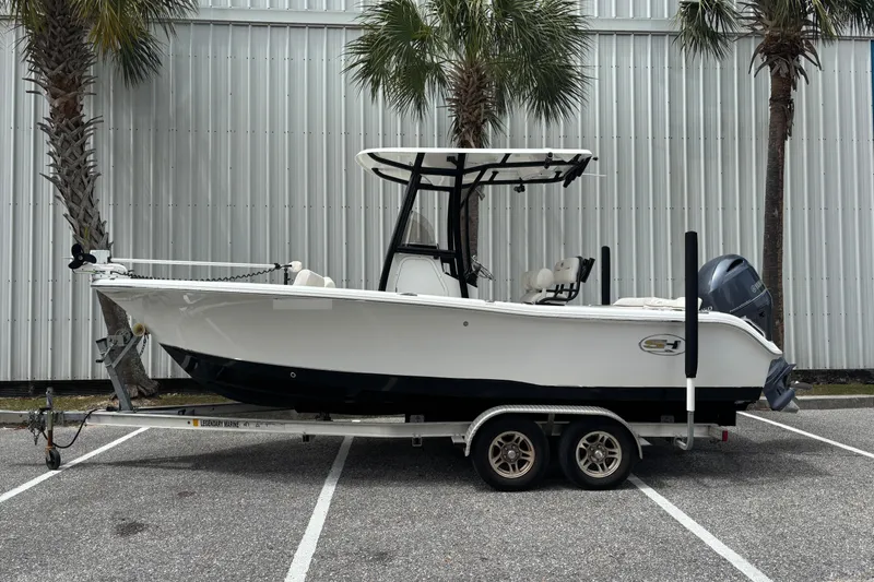The Image of 2021 Sea Hunt Ultra 219 boat on trailer, side view. - 0