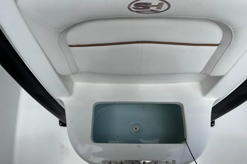 Slide: The Image of Interior view of a 2021 Sea Hunt Ultra 219 boat, featuring a livewell. - 13