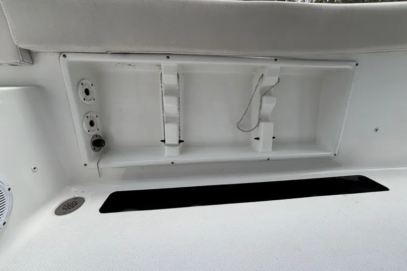 Slide: The Image of Interior compartment of a 2021 Sea Hunt Ultra 219 boat, featuring storage and utility fixtures. - 17