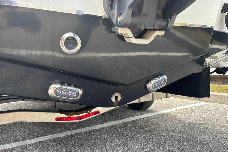 Slide: The Image of Rear view of 2021 Sea Hunt Ultra 219 boat with underwater lights and trailer. - 26