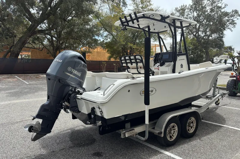 Slide: The Image of 2021 Sea Hunt Ultra 219 boat on trailer with Yamaha engine. - 3