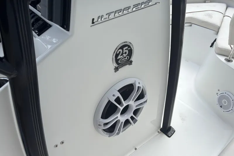 Slide: The Image of 2021 Sea Hunt Ultra 219 boat interior with speaker and 25th anniversary badge. - 6