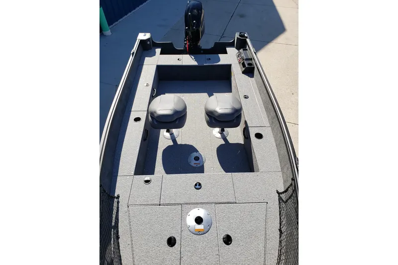 Slide: The Image of 2026 Alumacraft Classic 165 Tiller boat interior with seating and motor. - 10