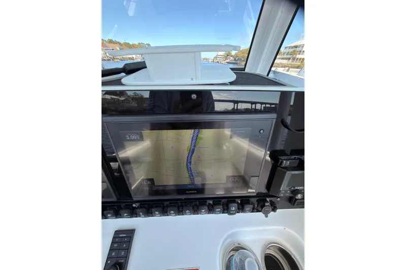 Slide: The Image of 2021 Sea Hunt Gamefish 25 boat dashboard with Garmin navigation display. - 14