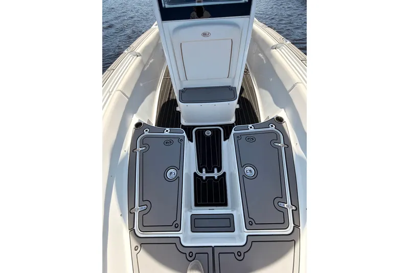 Slide: The Image of 2021 Sea Hunt Gamefish 25 boat deck with storage compartments and sleek design. - 20