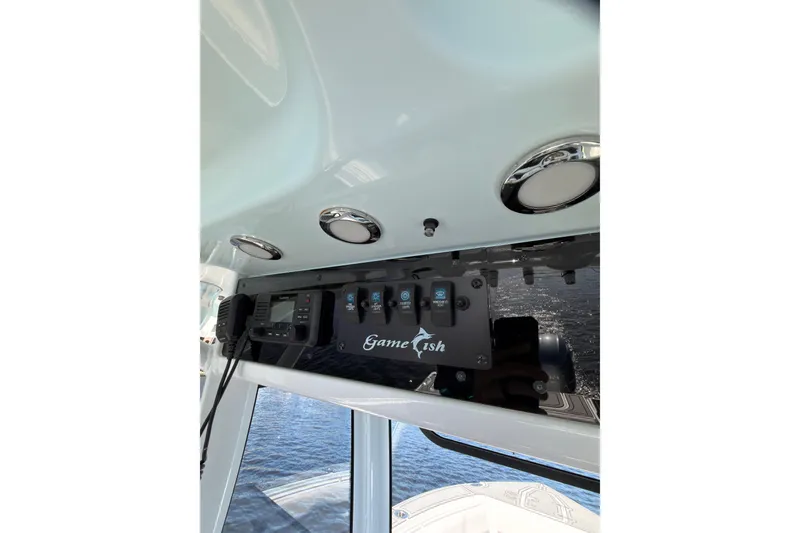 Slide: The Image of 2021 Sea Hunt Gamefish 25 boat console with controls and electronics. - 21