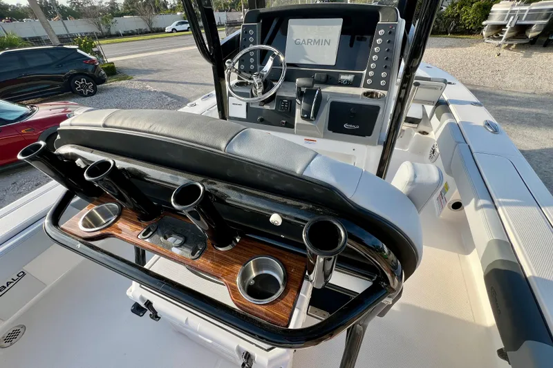 Slide: The Image of 2026 Robalo 246 Cayman boat interior with Garmin display and rod holders. - 16
