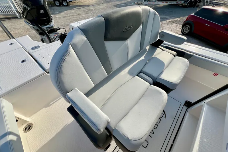 Slide: The Image of 2026 Robalo 246 Cayman boat seating with cushioned armrests and sleek design. - 18
