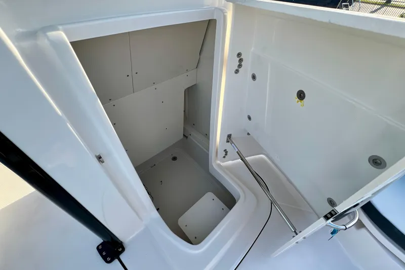Slide: The Image of 2026 Robalo 246 Cayman boat storage compartment, open and spacious design. - 26