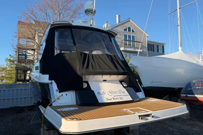 Slide: The Image of 2013 Regal 35 Sport Coupe docked, featuring "Life Goes On" signage, Toms River, NJ. - 19