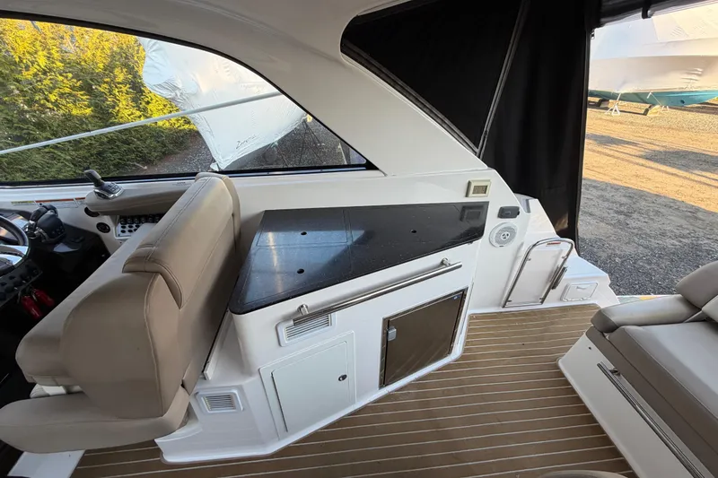 Slide: The Image of Interior of a 2013 Regal 35 Sport Coupe with seating and countertop. - 25