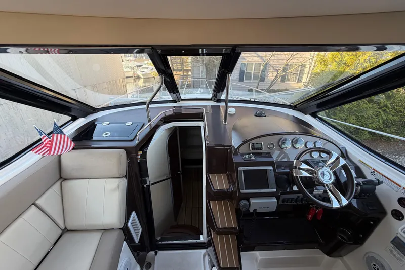Slide: The Image of Interior view of 2013 Regal 35 Sport Coupe cockpit with steering wheel and navigation equipment. - 27