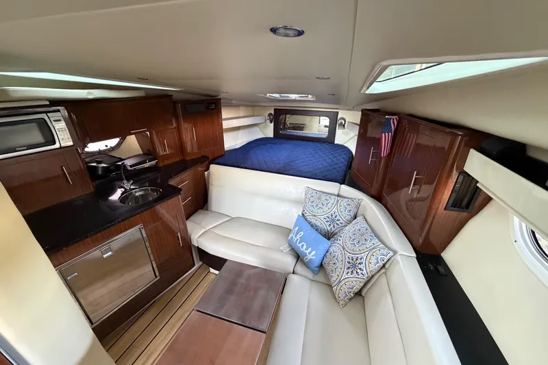Slide: The Image of Luxurious interior of 2013 Regal 35 Sport Coupe with kitchenette and cozy seating area. - 31
