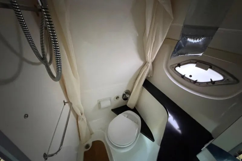 Slide: The Image of Bathroom interior of 2013 Regal 35 Sport Coupe yacht with shower and porthole window. - 35