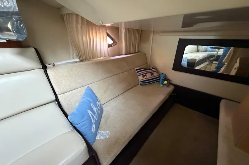 Slide: The Image of Interior of 2013 Regal 35 Sport Coupe with beige seating and decorative pillows. - 37