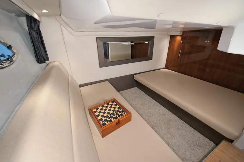 Slide: The Image of Manufacturer Provided Image: Interior of 2013 Regal 35 Sport Coupe with beige seating and chessboard. - 9