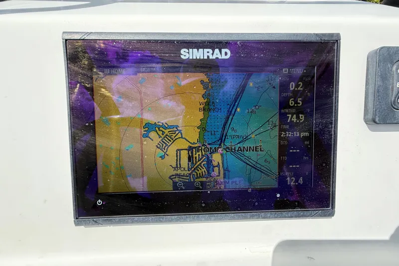 Slide: The Image of Simrad GPS display on 2017 Beavertail Skiffs Lightning, showing navigational map and data. - 11