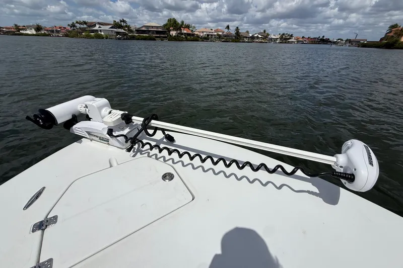 Slide: The Image of 2017 Beavertail Skiffs Lightning boat with trolling motor on calm water. - 26