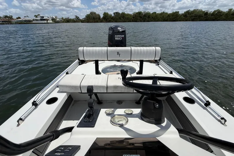 Slide: The Image of 2017 Beavertail Skiffs Lightning on calm water with Evinrude 150 engine. - 31