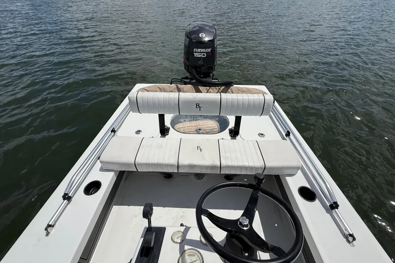 Slide: The Image of 2017 Beavertail Skiffs Lightning boat with Evinrude 150 engine on calm water. - 32