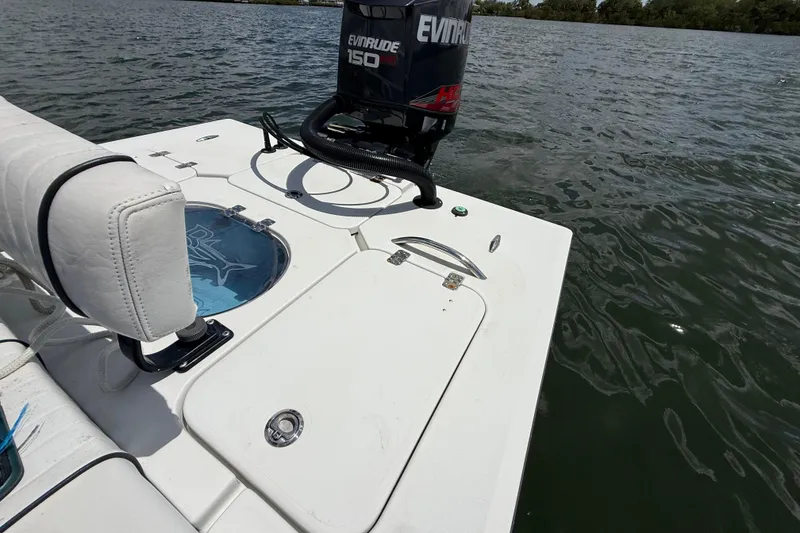 Slide: The Image of 2017 Beavertail Skiffs Lightning boat with Evinrude 150 HP engine on water. - 36