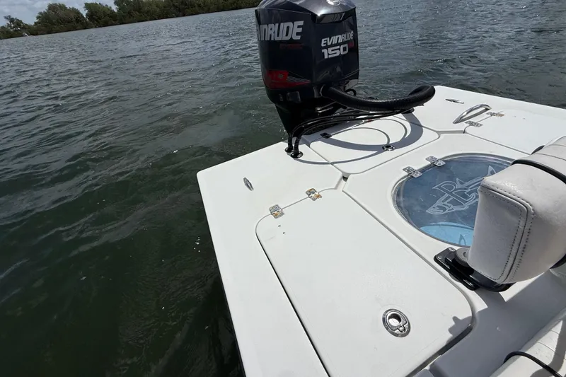 Slide: The Image of 2017 Beavertail Skiffs Lightning boat with Evinrude 150 engine on water. - 38