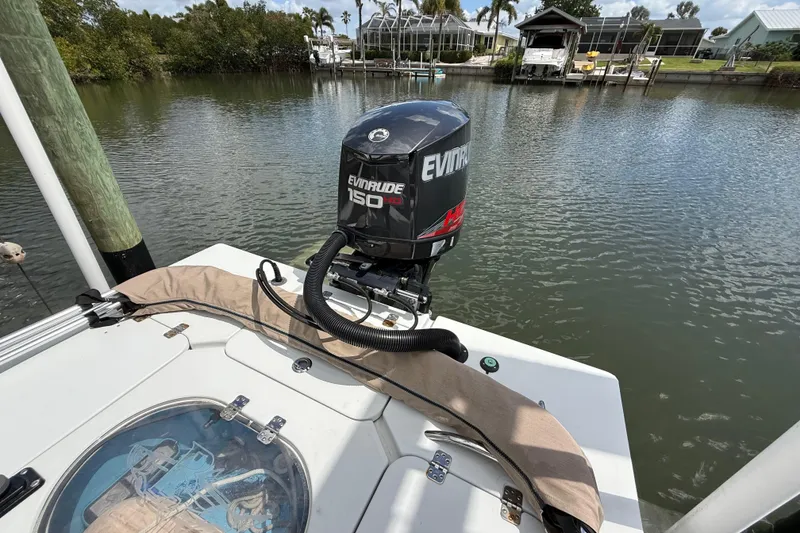 Slide: The Image of 2017 Beavertail Skiffs Lightning with Evinrude 150 engine on a calm waterway. - 46