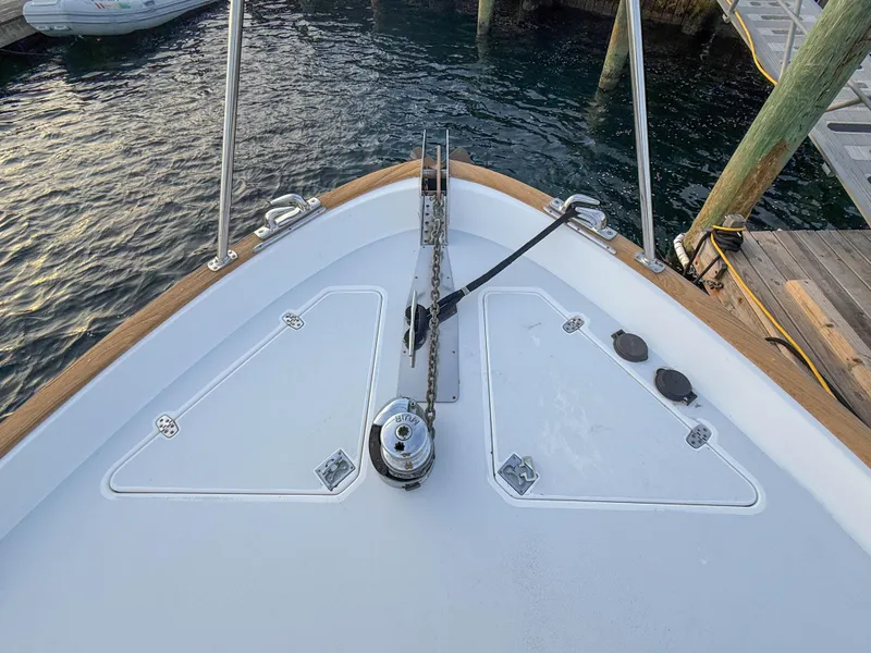 Slide: The Image of Bow of 2002 Legacy 34 Express boat docked at marina. - 48