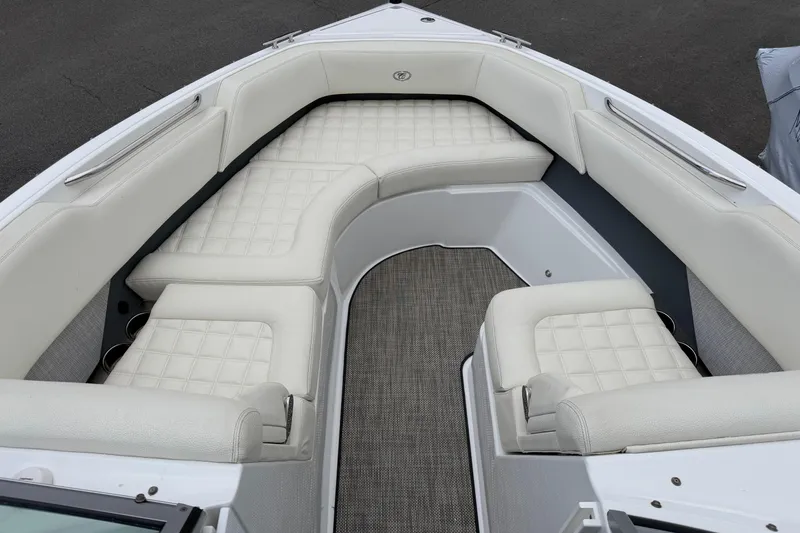 Slide: The Image of 2019 Cobalt R5 boat interior with white cushioned seating and gray flooring. - 3