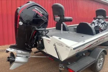 Slide: The Image of 2021 Tracker Pro Team 190 TX Tournament Edition boat with powerful outboard motor. - 4