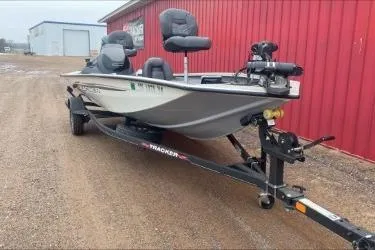 Slide: The Image of 2021 Tracker Pro Team 190 TX Tournament Edition boat on trailer, parked outdoors. - 5
