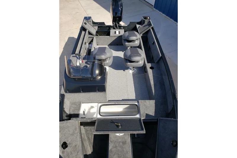 Slide: The Image of 2026 Alumacraft Classic 165 SC boat interior with seating and storage compartments. - 13