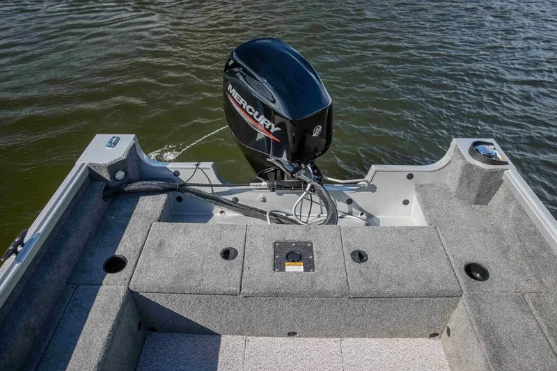 Slide: The Image of 2026 Alumacraft Classic 165 SC boat with Mercury outboard motor on water. - 5