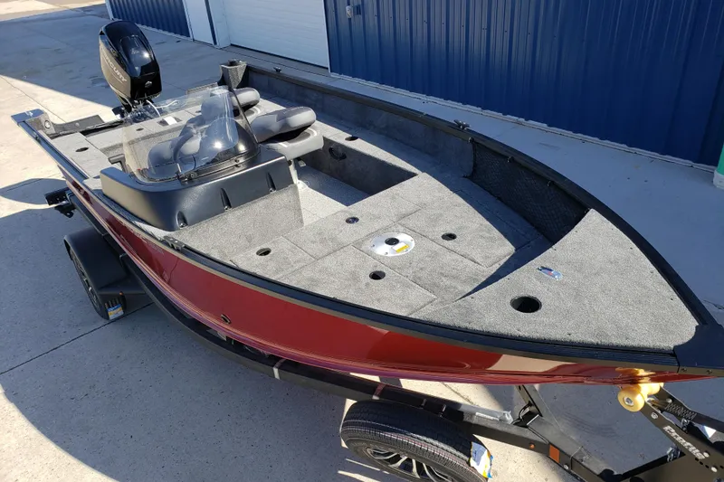 Slide: The Image of 2026 Alumacraft Classic 165 SC fishing boat with red exterior and spacious deck. - 7