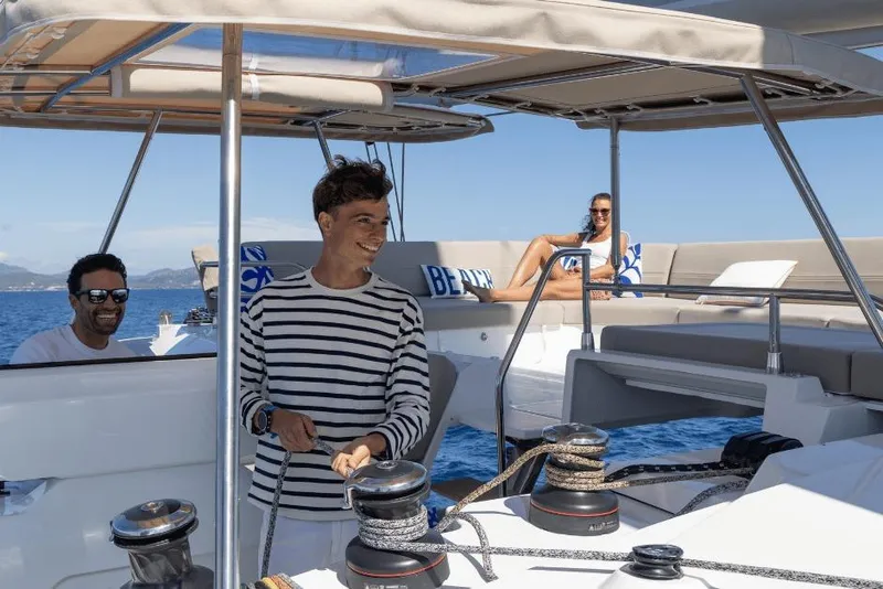 Slide: The Image of People enjoying a day on a 2026 Fountaine Pajot 44 catamaran. - 12