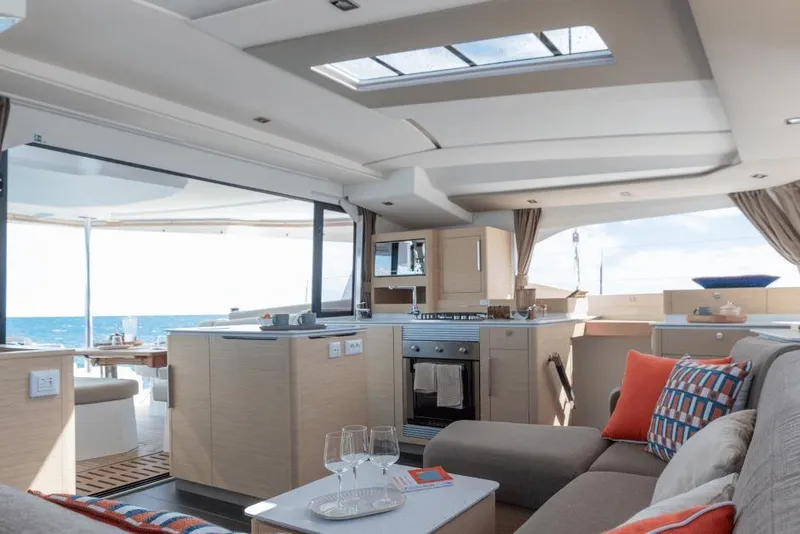 Slide: The Image of Luxurious interior of 2026 Fountaine Pajot 44 yacht with modern kitchen and ocean view. - 15
