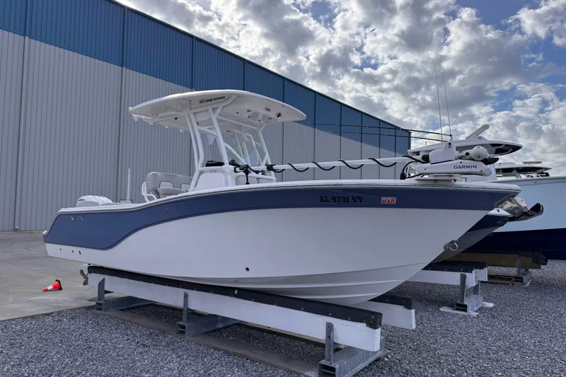 The Image of 2024 Sea Fox 248 Commander boat on display outside a large warehouse. - 1