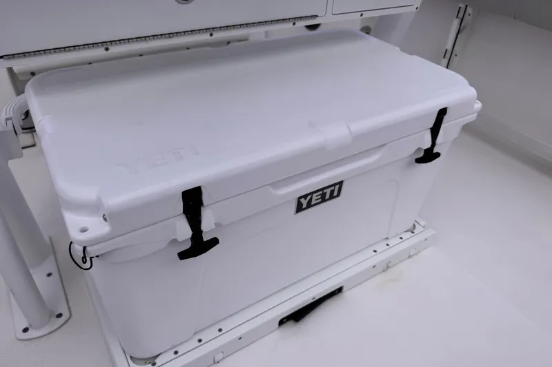 Slide: The Image of YETI cooler on 2024 Sea Fox 248 Commander boat deck, featuring secure latches. - 10