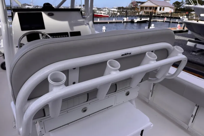 Slide: The Image of 2024 Sea Fox 248 Commander boat interior with rod holders and helm station. - 11