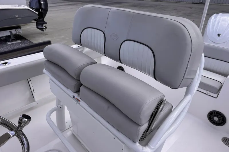 Slide: The Image of 2024 Sea Fox 248 Commander boat seating with cushioned helm and sleek design. - 13