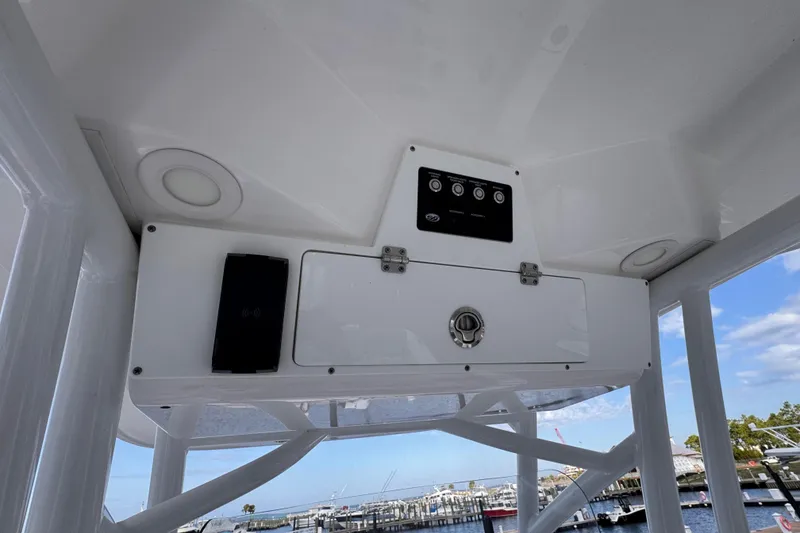 Slide: The Image of 2024 Sea Fox 248 Commander boat console with control panel and storage compartment. - 19