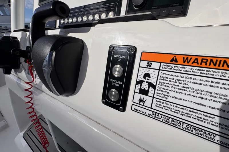 Slide: The Image of Control panel of 2024 Sea Fox 248 Commander boat with warning label and windlass controls. - 20