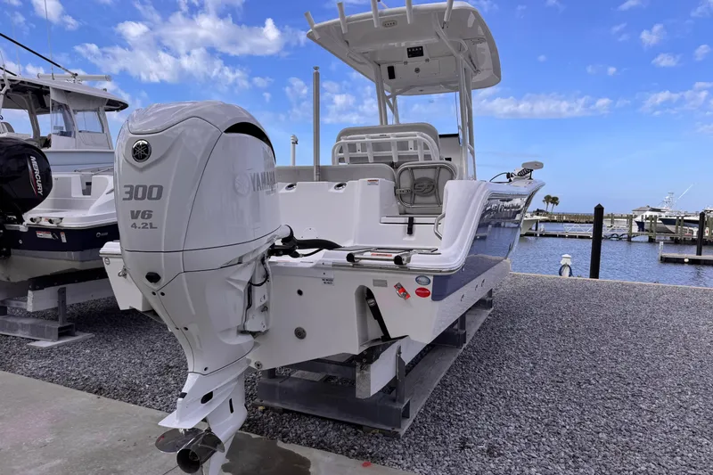 Slide: The Image of 2024 Sea Fox 248 Commander boat with Yamaha 300 V6 engine at marina. - 4