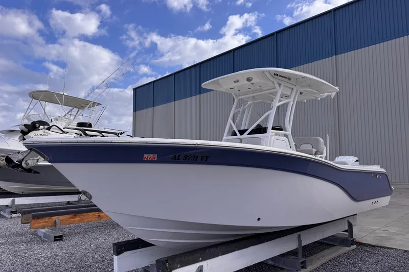 Slide: The Image of 2024 Sea Fox 248 Commander boat displayed outdoors against a blue sky backdrop. - 6