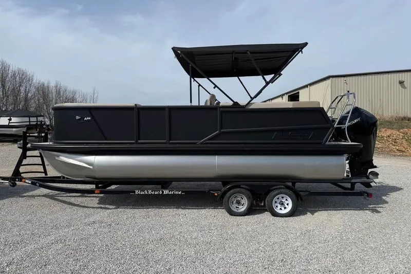 The Image of Alera 22q 2026 pontoon boat on trailer, black exterior, parked outdoors. - 0