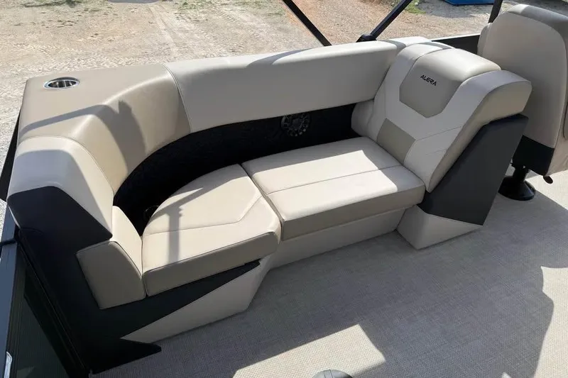 Slide: The Image of Luxurious seating on 2026 Alera 22q boat, featuring beige upholstery and modern design. - 10